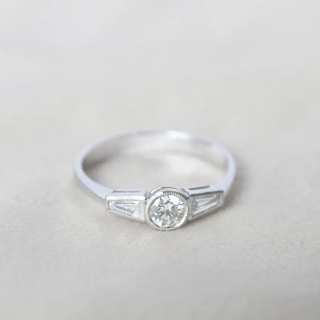 Art Deco Style 0.60 Carat Brilliant and Baguette Cut Diamond Ring